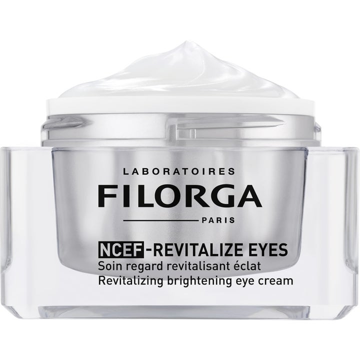 Filorga NCEF-Revitalize Eyes 15 ml revitaliserande ögonkräm för lyster i öppen silverburk med vit krämig textur
