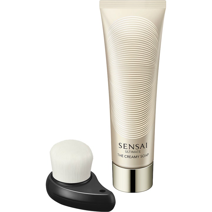 Sensai Ultimate The Creamy Soap 125 ml ansiktsrengöring med borste för torr hud i elegant guldskimrande tub.