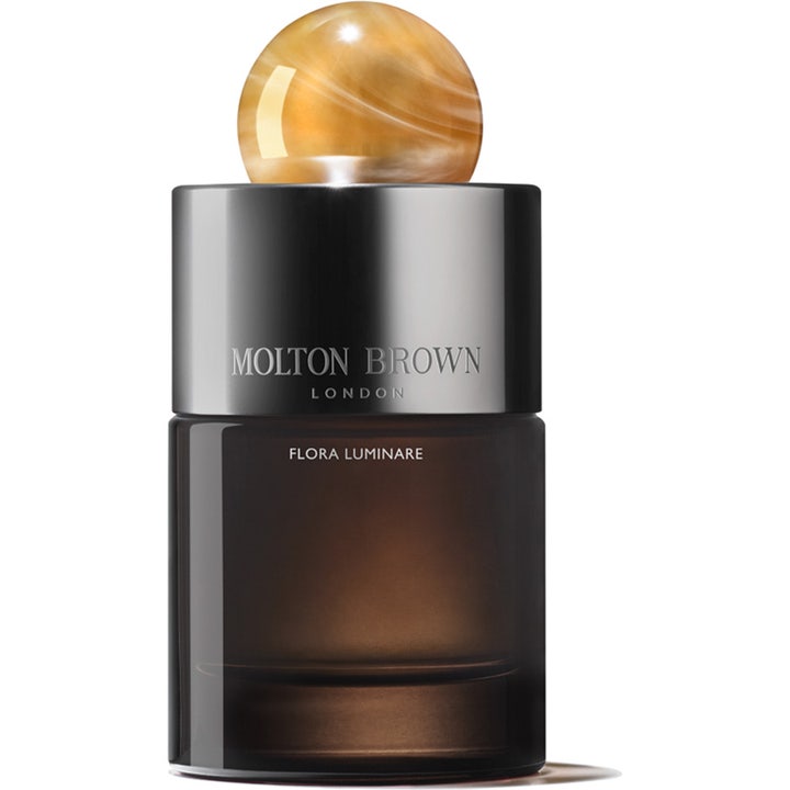 Molton Brown Flora Luminare 100 ml blommig parfym i mörk glasflaska med silverkork prydd av en bärnstensfärgad kula