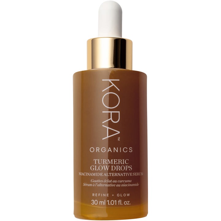 KORA Organics Turmeric Glow Drops 30 ml lystergivande ansiktsserum i bärnstensfärgad flaska med guldkork och pipett