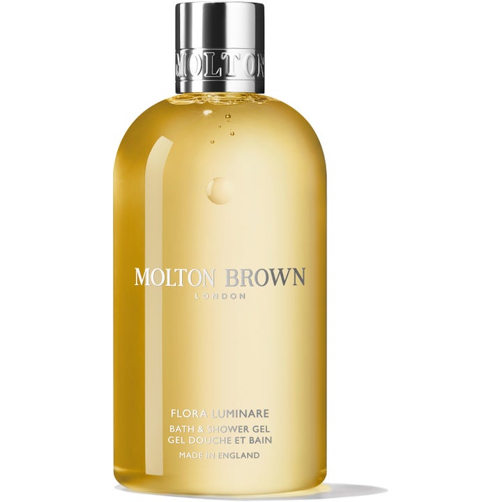 Molton Brown Flora Luminare blommig Molton Brown duschgel med gyllene formula i genomskinlig flaska med silverkork