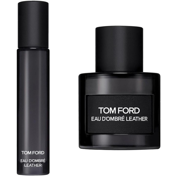 Tom Ford Eau d'Ombre Leather parfym i två svarta glasflaskor med mattsvarta lock och texturerad etikett