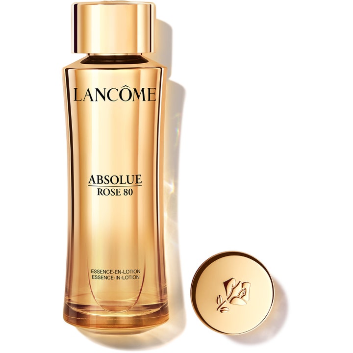 Lancôme Absolue Rose 80 roslotion lyxlotion för ansiktet i en gyllene glasflaska med guldkork och ingraverad ros.