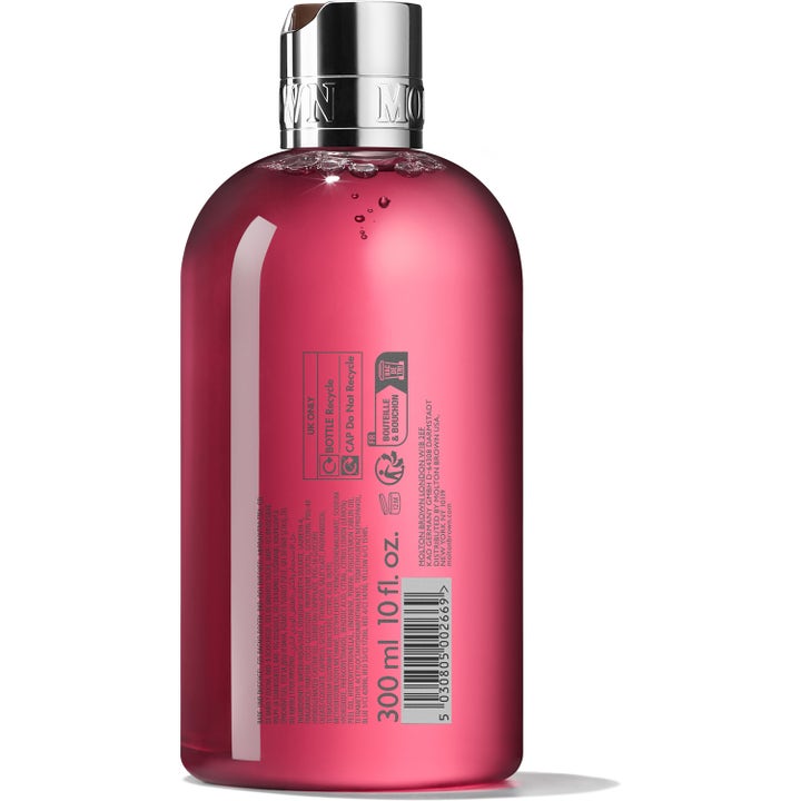 Molton Brown Fiery Pink Pepper 300 ml kryddig duschgel i genomskinlig flaska med silverkork sedd från baksidan.