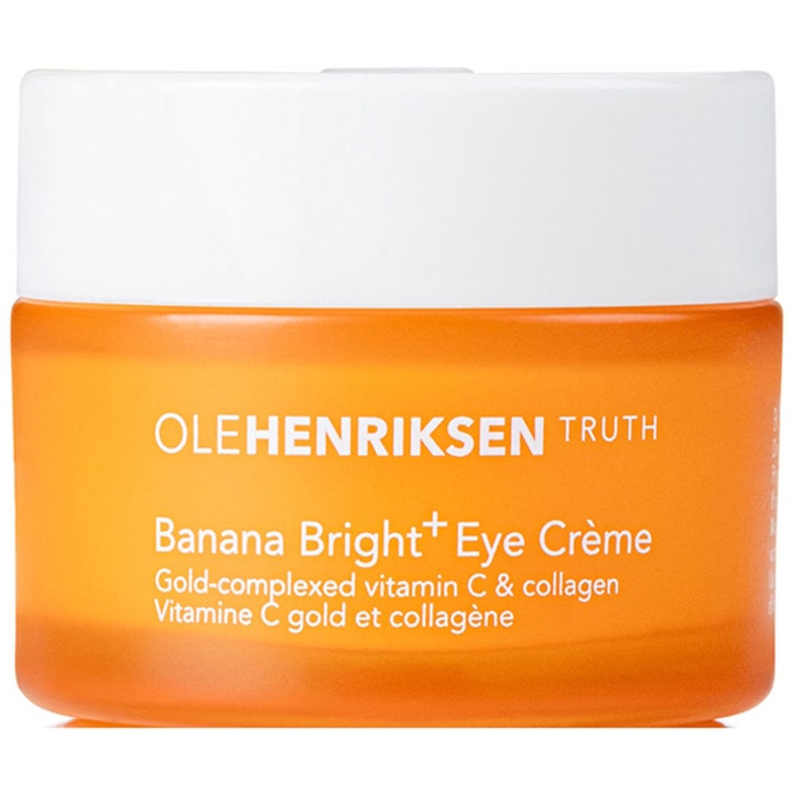 Ole Henriksen Banana Bright+ Eye Crème vitamin c ögonkräm som ger lyster i en orange frostad glasburk med vitt lock.
