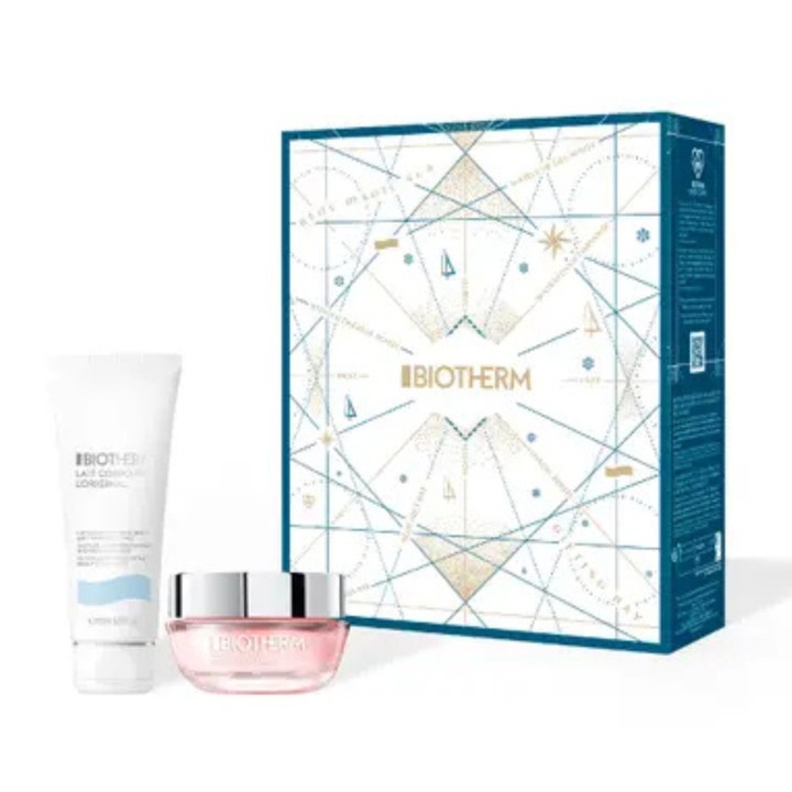 Biotherm återfuktande hudvårdsset med ansiktskräm i rosa glasburk och vit tub framför en geometriskt mönstrad box.