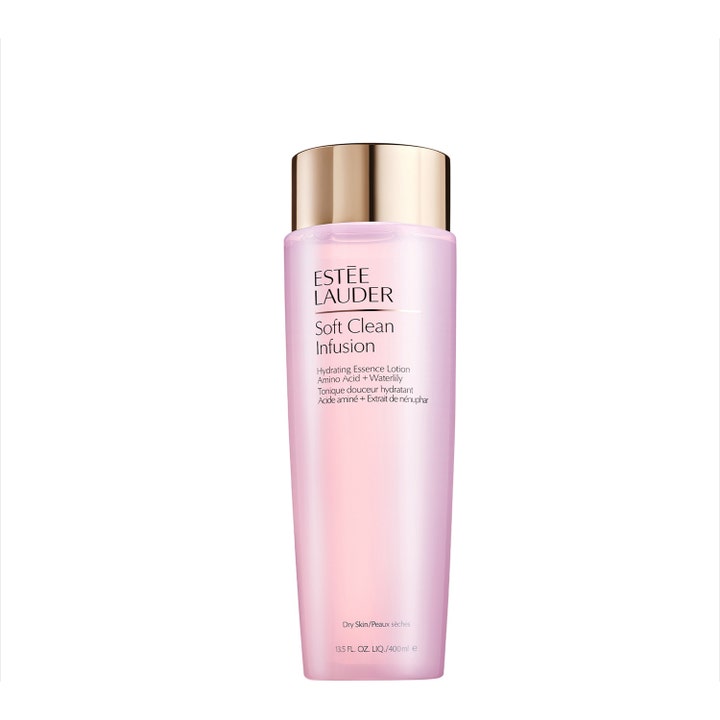 Estée Lauder Soft Clean Infusion 400 ml återfuktande essence med aminosyror i en ljusrosa flaska med lyxigt guldfärgat lock.
