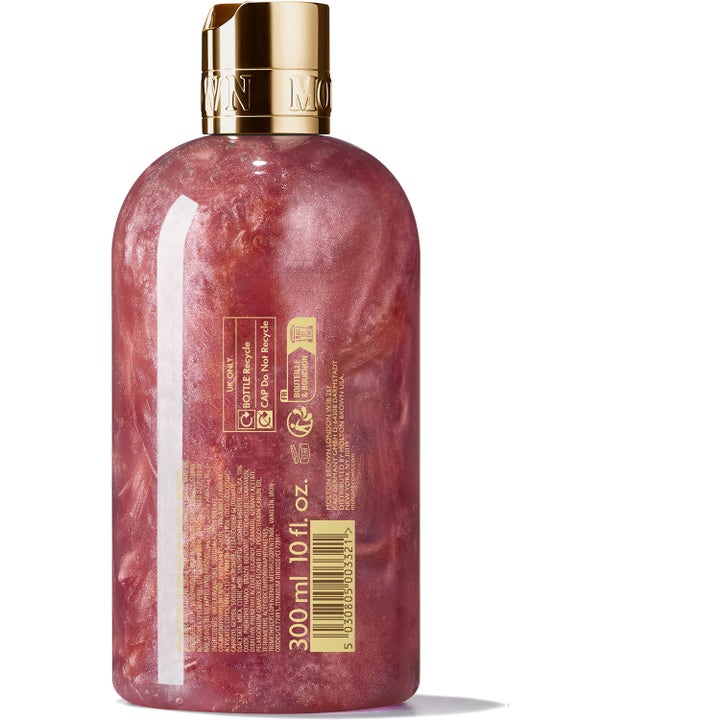 Molton Brown Rose Dunes 300 ml rosduschtvål i flaska med skimrande rosa gel och guldlock från baksidan
