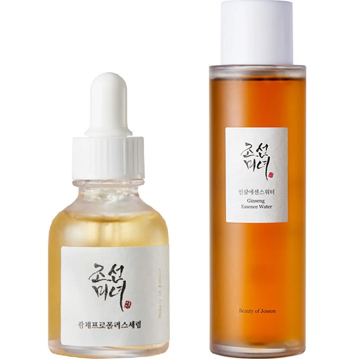 Beauty of Joseon Glow Serum och Ginseng Essence Water ger lyster i pipettflaska och hög bärnstensfärgad flaska.
