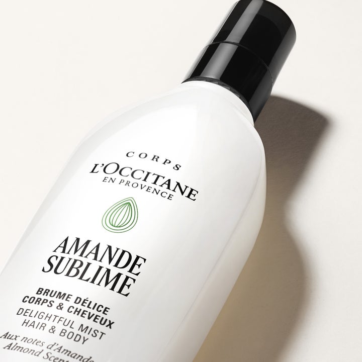L'Occitane en Provence Almond Hair Body Mist 100 ml mist i vit flaska med svart lock som ger en mjuk mandelparfym.