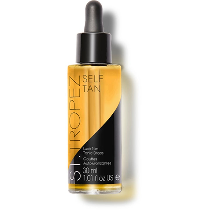 St Tropez Luxe Tan Tonic Drops 30 ml lystergivande glow tan drops i glasflaska med svart pipettkork och gyllene vätska.