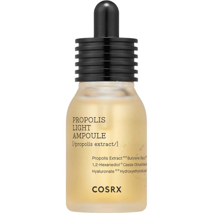 COSRX Propolis Light Ampoule 30ml antiinflammatoriskt serum känslig hud i frostad flaska med svart pipettkork.