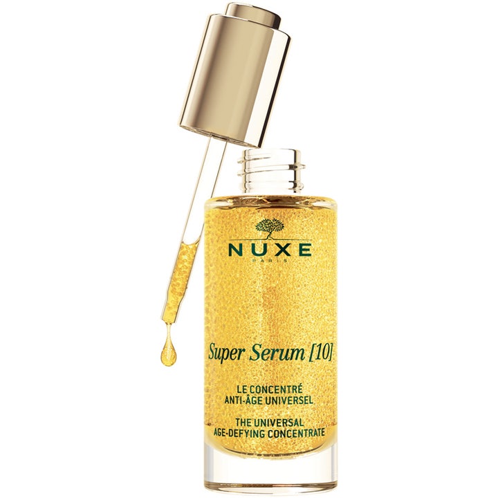 Nuxe Super Serum 50 ml nuxe anti aging serum ger lyster med guldglittrande mikropärlor i glasflaska med pipett.