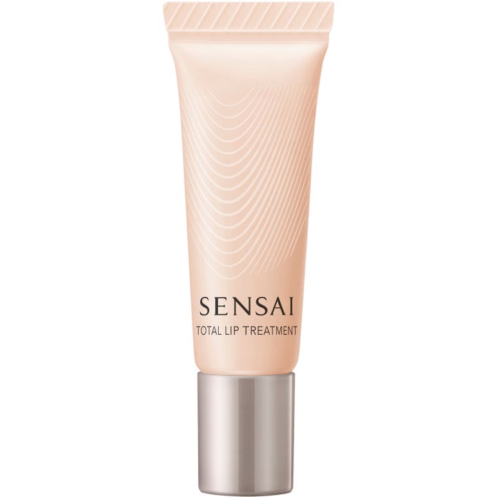 Sensai Neck & Decollette Care Limited Set 125 ml mjukgörande läppvård i en persikofärgad tub med elegant silverkork.