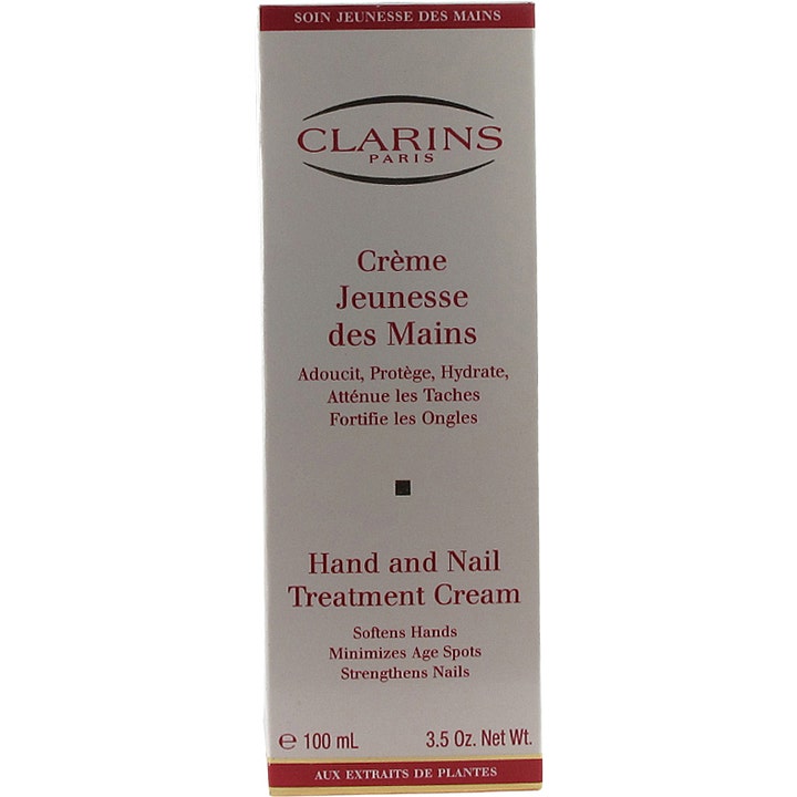 Clarins Hand & Nail Treatment Cream 100 ml handkräm i vit ytterförpackning som motverkar åldersfläckar och stärker naglar.