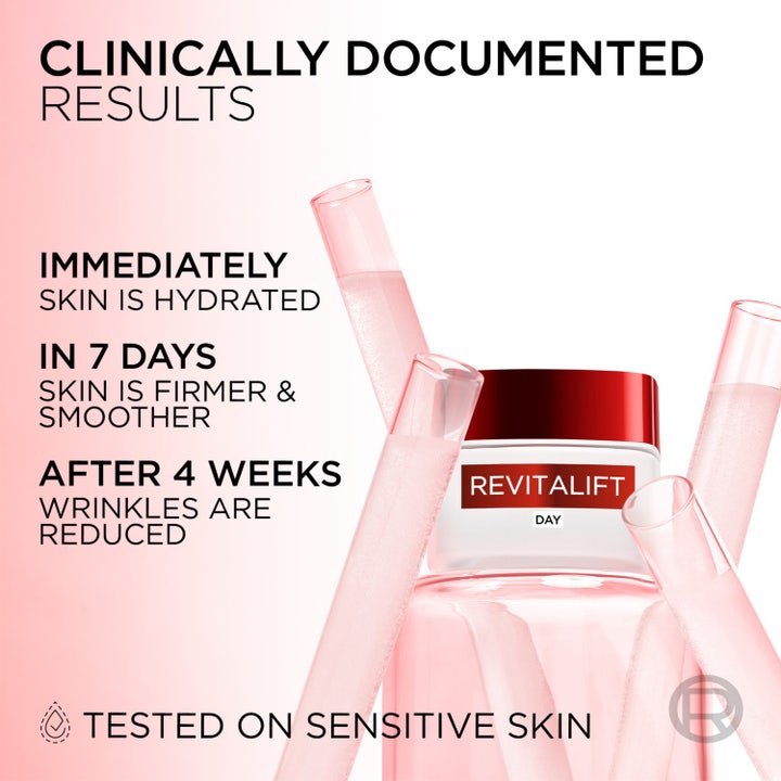 L'Oréal Paris Revitalift näringsrik dagkräm med anti-aging effekt 50 ml i vit glasburk omgiven av rosa provrör