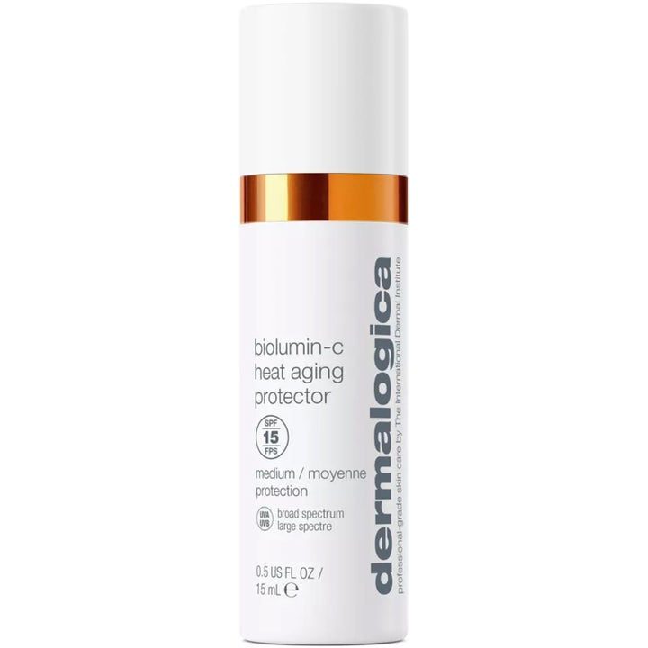 Dermalogica Biolumin-C Heat Aging Protector 15 ml lystergivande solskydd i vit flaska med orange metalldetalj.