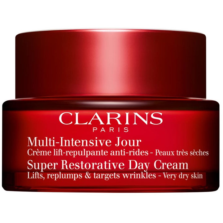 Clarins Super Restorative Day Cream anti-rynk återfuktande ansiktskräm som lyfter i en elegant röd glasburk.