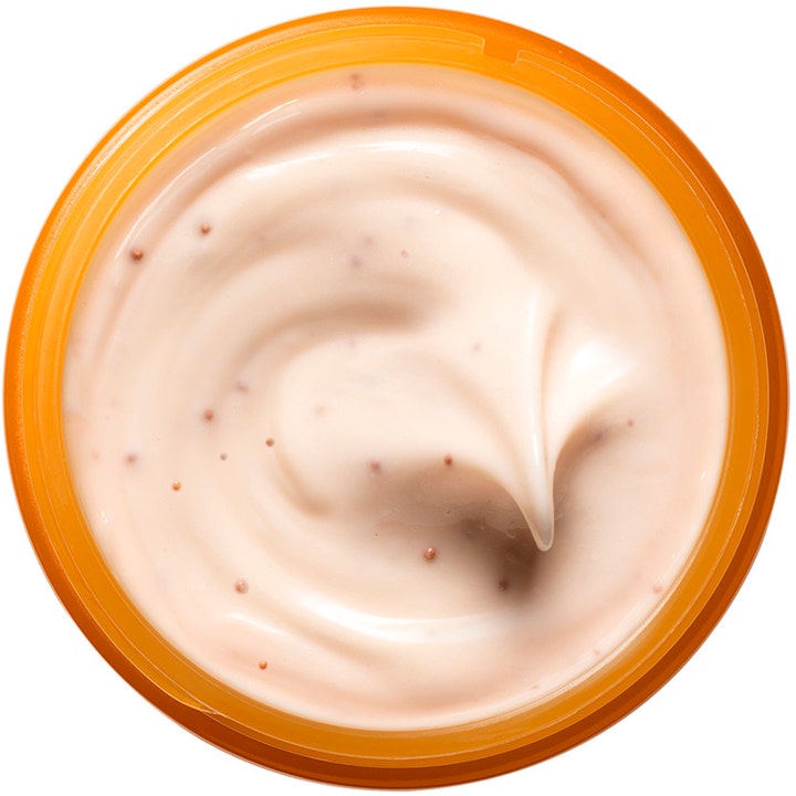 Origins GinZing Glow-Boosting Mask 75 ml ansiktsmask för ansiktslyster har en krämig textur med korn i en orange burk.