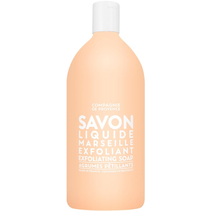 Compagnie de Provence Savon Liquide Marseille 1000ml ger citrus exfoliering i en persikofärgad flaska med vitt lock
