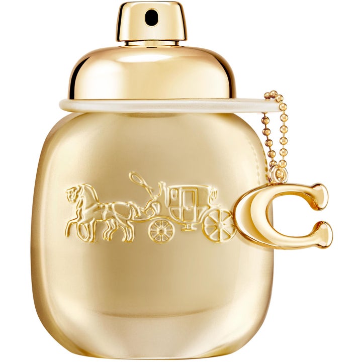 Coach Gold Eau de Parfum 30ml damparfym i en lyxig guldfärgad flaska med präglad hästlogotyp och dekorativt C-hänge