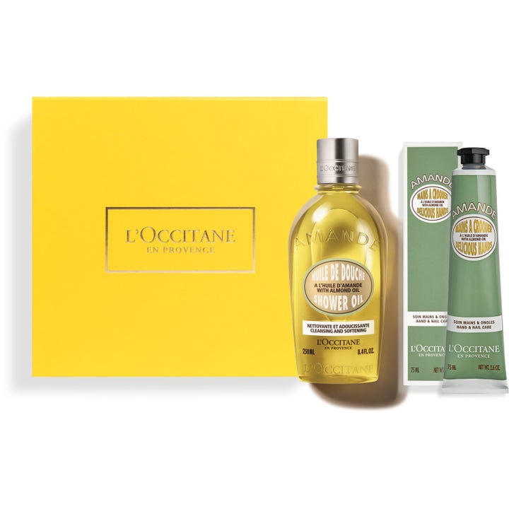 L'Occitane Amande gåvoset 250ml och 75ml mjukgörande hudvård i gul ask med gyllene duscholja och grön handkrämstub.