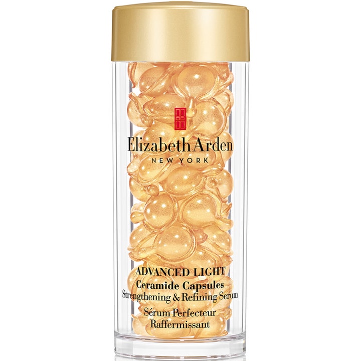 Elizabeth Arden Advanced Light Ceramide Capsules anti aging ceramid serum i genomskinlig cylinder med guldglänsande kapslar.