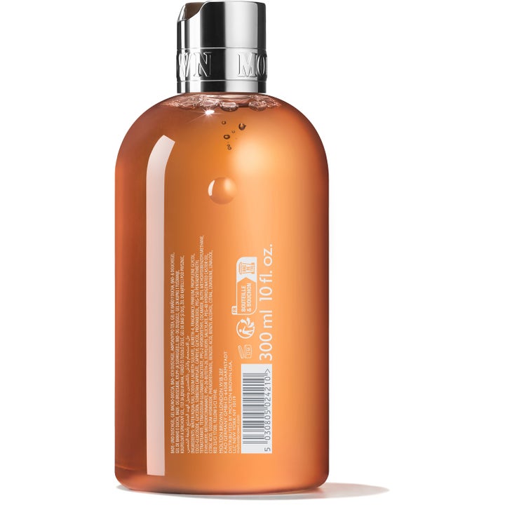 Molton Brown Sunlit Clementine & Vetiver 300 ml duschtvål citrus i flaska med silverlock och synlig ingredienslista.