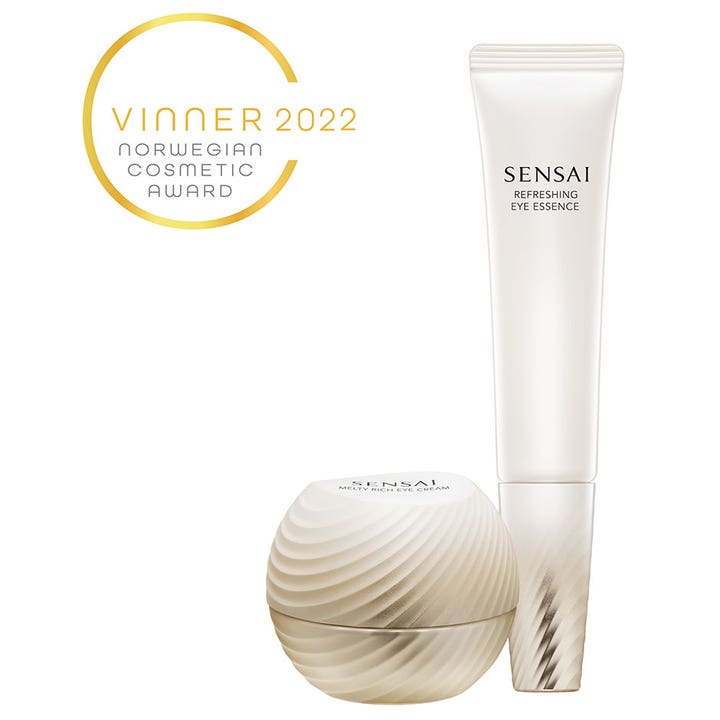 Sensai Total Eye Treatment anti-aging ögonkräm set med en vit tub och en rund mönstrad guldbeige burk.
