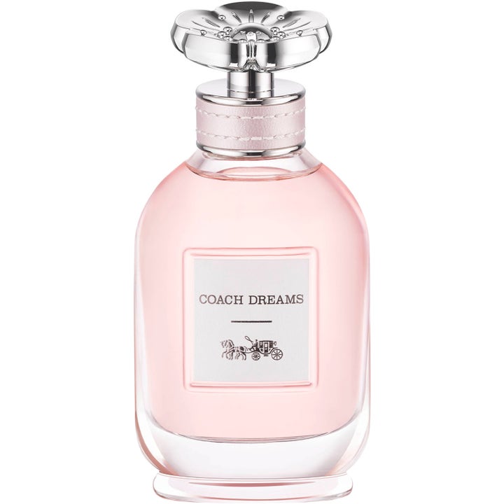 COACH Dreams Eau de Parfum 60 ml blommig parfym i rund glasflaska med ljusrosa vätska och ett silverlock format som en blomma