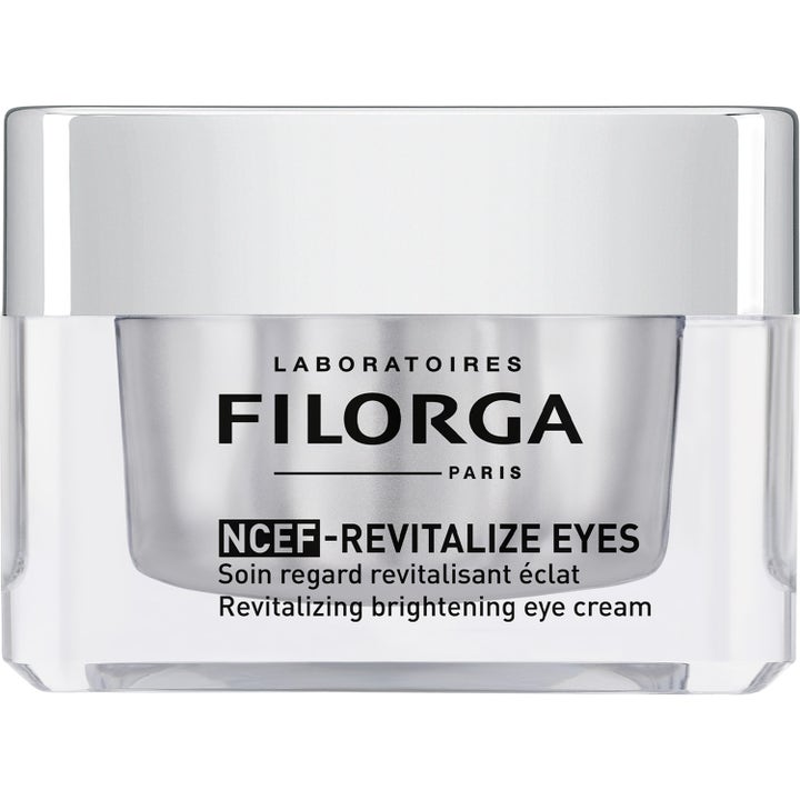 Filorga NCEF-Revitalize Eyes 15 ml lystergivande ögonkräm i en silverfärgad glasburk med matchande silverlock.