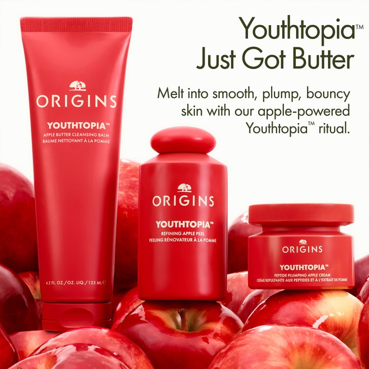Origins Youthtopia Apple Butter Cleansing Balm 125 ml i röd tub bland äpplen som ger mjuk hud.