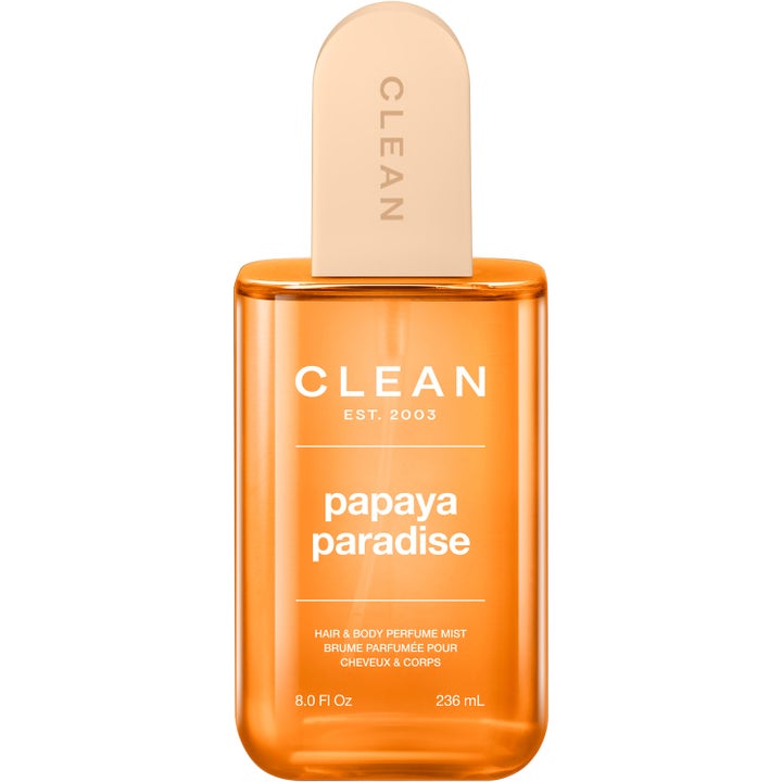 Clean Papaya Paradise 236ml uppfriskande hårparfym i en orange transparent flaska med ett ljuspersikofärgat lock