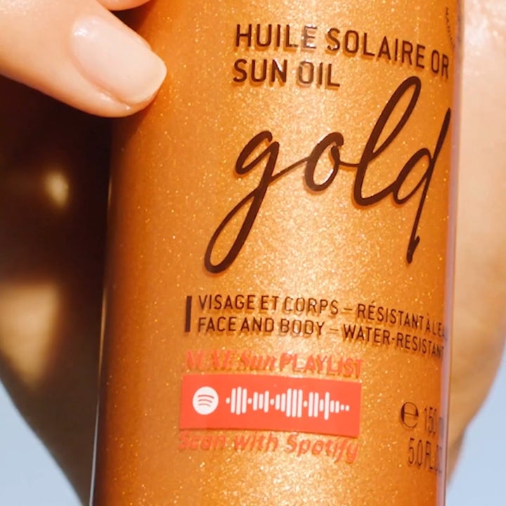 Nuxe Sun Tanning Oil Gold 150 ml lyxig sololja med spf50 ansikte och kropp i guldskimrande flaska med Spotify-kod