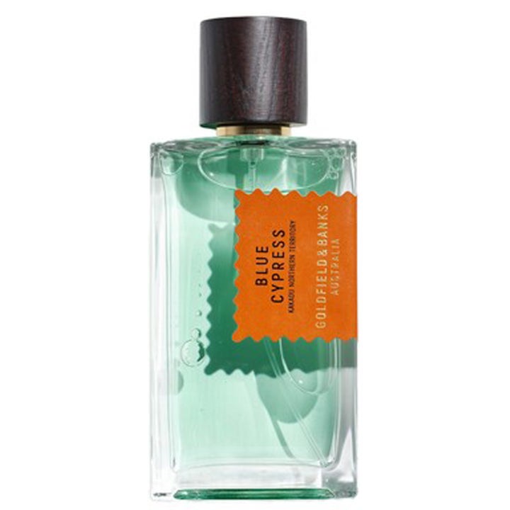 Goldfield & Banks Blue Cypress 100 ml nischparfym i glasflaska med turkos vätska, orange etikett och mörkt trälock