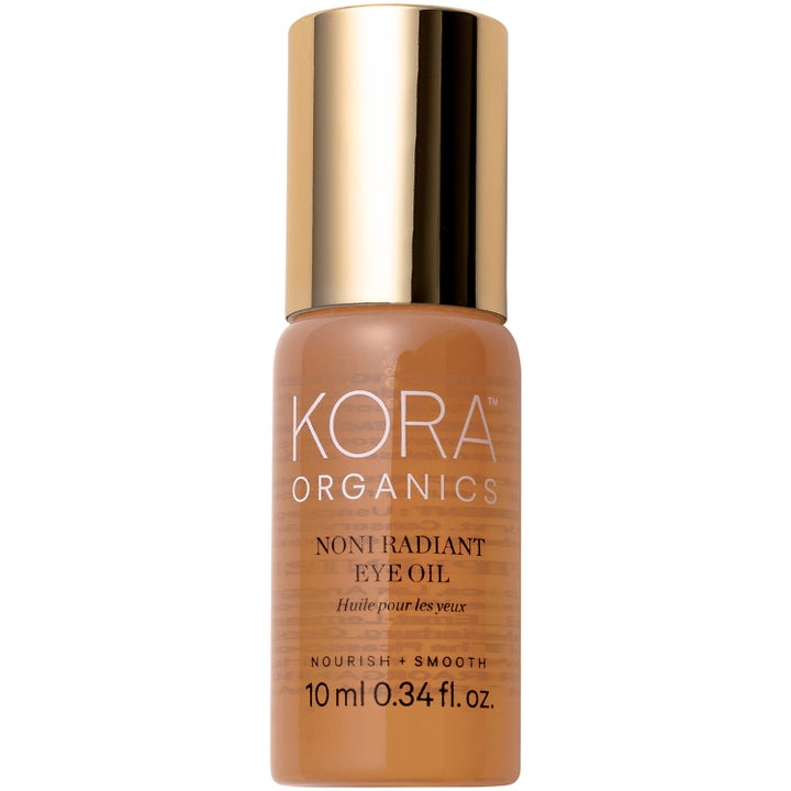 KORA Organics Noni Radiant Eye Oil 10 ml närande KORA ögonbehandling i frostad bärnstensfärgad flaska med guldkork.