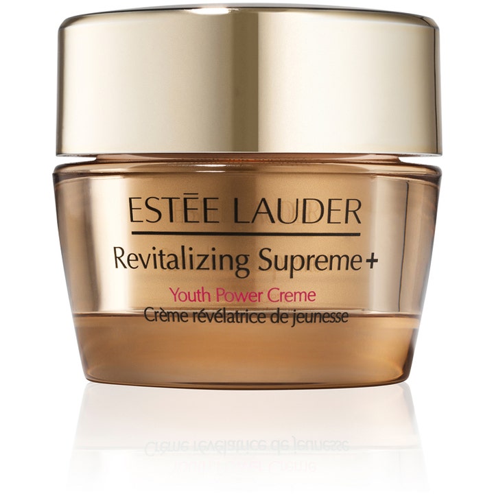 Estée Lauder Revitalizing Supreme+ antiaging dagkräm i lyxig guldglänsande glasburk med matchande guldlock.