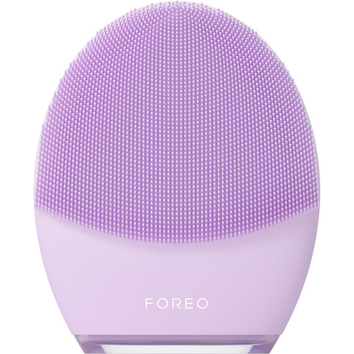FOREO Luna 4 ansiktsrengöring maskin är en ljust lila silikonborste för ansiktsrengöring som ger lyster.