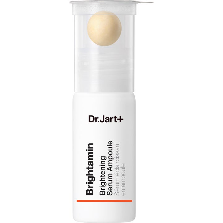 Dr.Jart+ Brightamin Brightening Serum Ampoule som ger lyster i vit flaska med genomskinlig kork och en gul pärla
