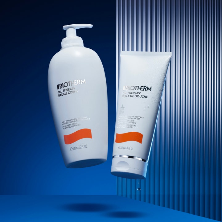Biotherm Oil Therapy 200 ml återfuktande duscholja för känslig torr hud i vit tub med orange våg och vattendroppar