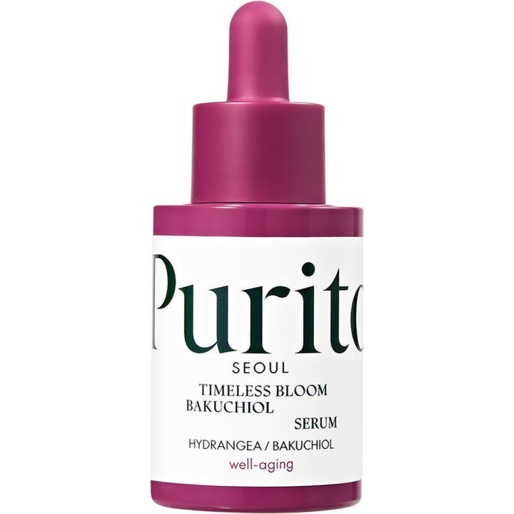 Purito Timeless Bloom Bakuchiol Serum förbättrar hudelasticitet i en lila glasflaska med vit etikett och pipett.