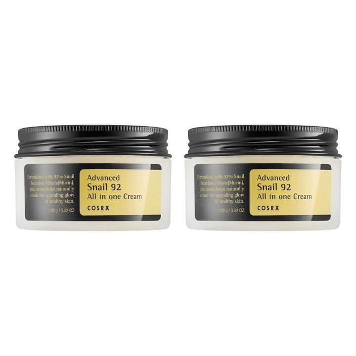 COSRX Advanced Snail 92 All in one Cream 100g reparerande återfuktande ansiktskräm i två vita burkar med svarta lock