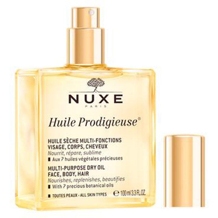 Nuxe Huile Prodigieuse 100 ml dry oil ger näring i en fyrkantig glasflaska med glansig guldkork.