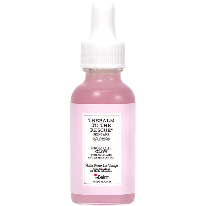 theBalm To The Rescue Face Oil Glow 30 ml lystergivande abyssinian ansiktsolja i glasflaska med rosa innehåll och vit pipett