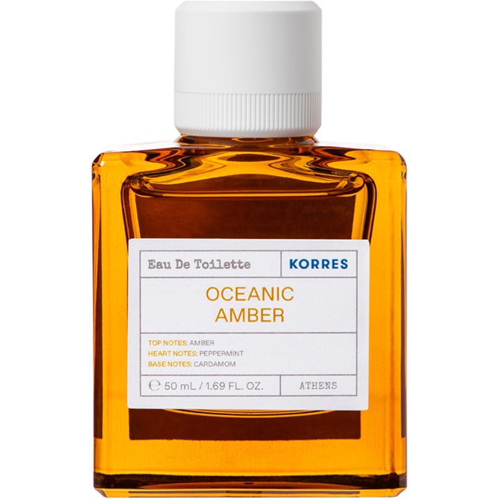Korres Oceanic Amber 50 ml havsinspirerad kryddig parfym i en bärnstensfärgad glasflaska med vitt lock och vit etikett