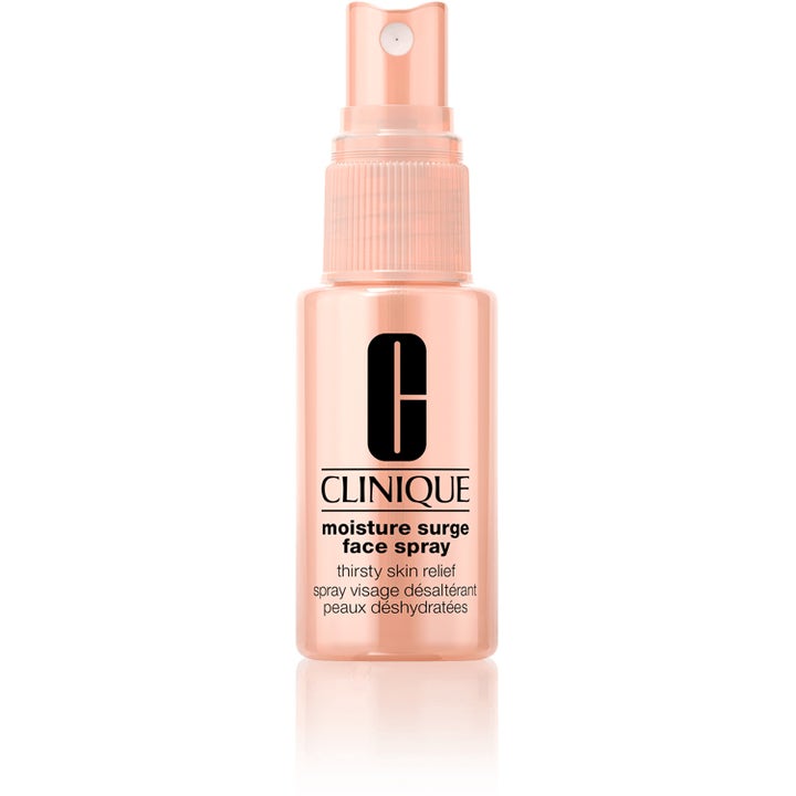 Clinique Moisture Surge Face Spray 30 ml återfuktande ansiktsspray för törstig hy i persikofärgad flaska med pump