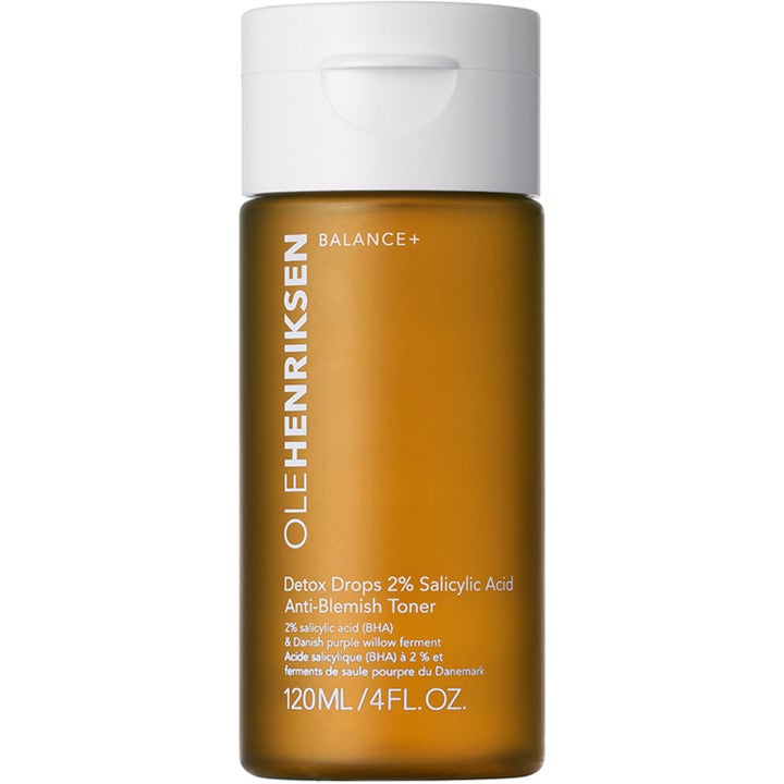 Ole Henriksen Detox Drops 120 ml ansiktsvatten med salicylsyra i frostad bärnstensfärgad flaska med vitt lock.