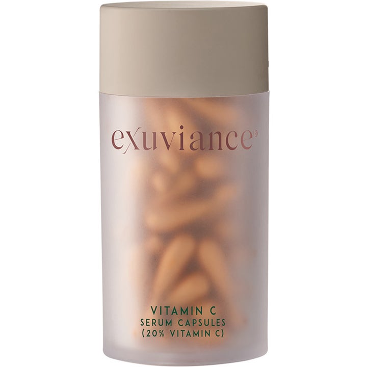 Exuviance Vitamin C Serum Capsules lystergivande anti age c vitamin serum i en frostad burk med beige lock och guldiga kapslar.