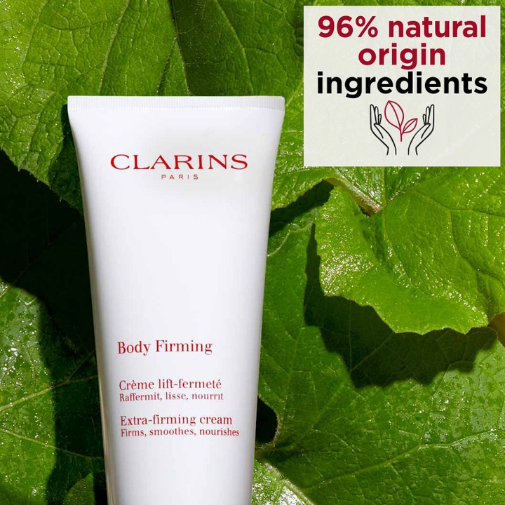 Clarins Body Firming Extra-Firming Cream 200 ml anti-aging kroppskräm i tub framför gröna blad.