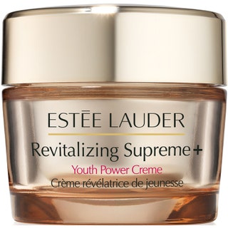 Estée Lauder Revitalizing Supreme+ Youth Power Creme uppstramande ansiktskräm i elegant guldtonad glasburk med guldlock.